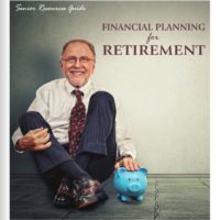 smiling man sitting on the floor with a piggy bank