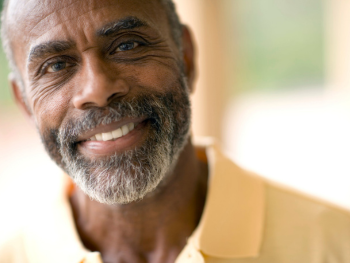smiling older man with a beard