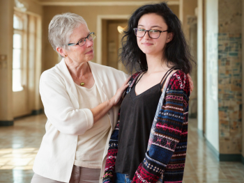 older woman gazes at younger woman