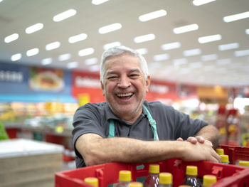 smiling man with groceries