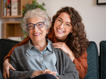 smiling grandmother and granddaughter