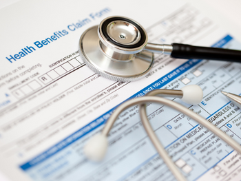stethoscope on benefits claim form
