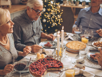 holiday dinner table and older guests