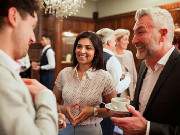 group of people chatting at a conference