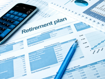 desk with retirement budget documents
