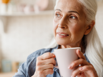woman holding coffee cup