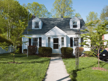 small house with a tidy yard