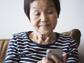 Older woman looking at smart phone