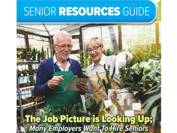older worker and woman look at plants in a shop