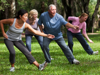 older adults do tai chi in the park