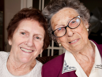 two smiling older women