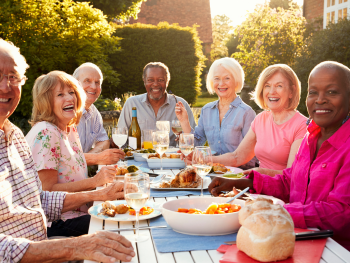 group of older adults enjoying a picnic