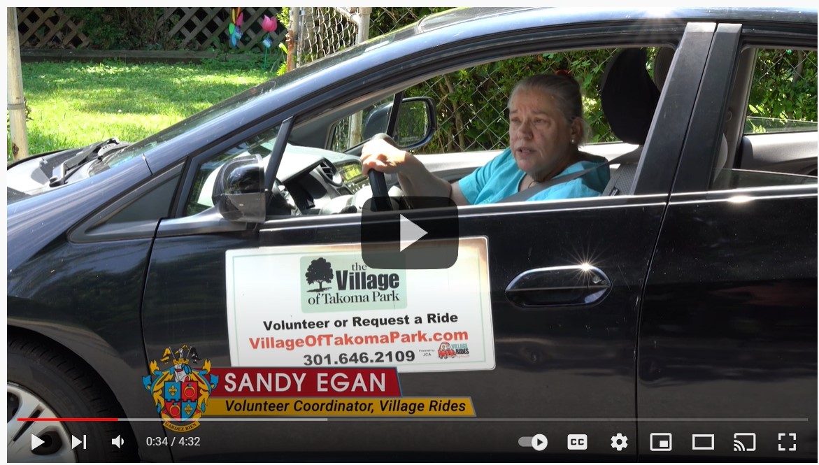 village rides volunteer driver in car